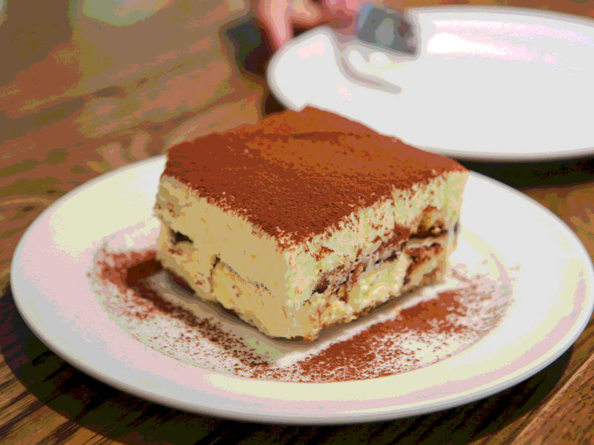Slab of tiramisu on plate restaurant illustrated recipe italian